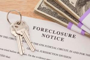 House Keys, Stack of Money and Foreclosure Notice photo