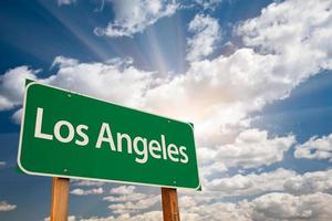 Los Angeles Green Road Sign Over Clouds photo