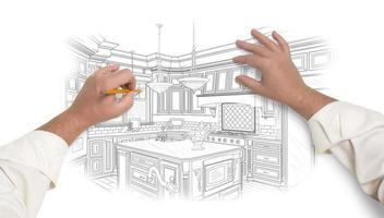 manos masculinas dibujando una hermosa cocina personalizada foto