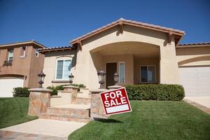 Home For Sale Sign and New House photo