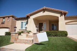 Blank Real Estate Sign and New Home photo