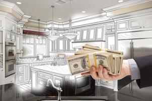 Hand Holding Cash Over Kitchen Design Drawing and Photo Combination