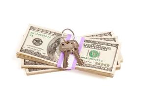 House Keys on Stack of Money Isolated photo