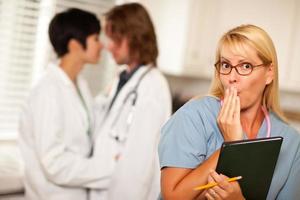 Alarmed Medical Woman Witnesses Colleagues Inner Office Romance photo