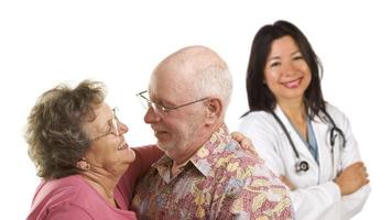 Senior Couple with Medical Doctor or Nurse Behind photo