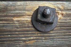 Antique Rusty Bolt, Washer and Wood photo