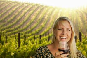 Attractive Young Woman With Wine Glass in A Vineyard. photo