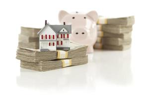 Small House and Piggy Bank with Stacks Money photo