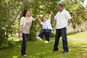 Young Family Having Fun in the Park photo