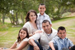Happy Hispanic Family In the Park photo