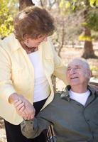 Happy Senior Couple Relaxing in The Park photo