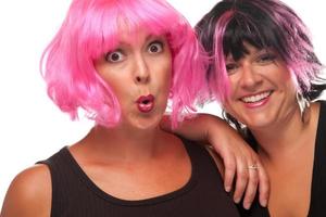 Portrait of Two Pink And Black Haired Smiling Girls photo