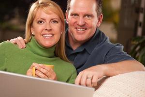 Handsome Couple Using Laptop photo