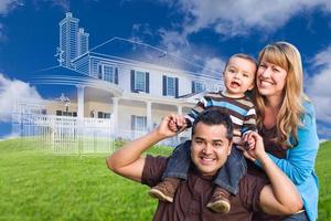 Mixed Race Family with Ghosted House Drawing Behind photo