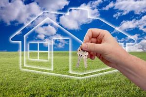 Handing Over Keys on Ghosted Home Icon, Grass Field and Sky photo