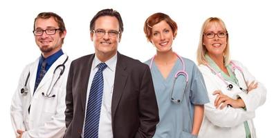 Smiling Businessman with Doctors and Nurses photo