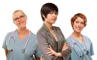 Young Mixed Race Woman with Doctors and Nurses Behind photo