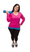 Hispanic Woman In Workout Clothes Lifting Dumbbell photo