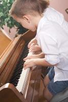 Children Playing the Piano photo