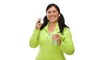 Hispanic Woman In Workout Clothes with Music Player and Headphones photo