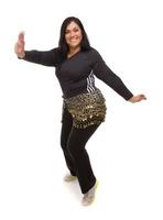 Attractive Hispanic Woman Dancing Zumba on White photo