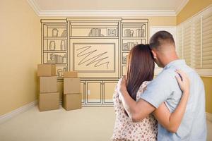 Military Couple In Empty Room with Shelf Drawing on Wall photo