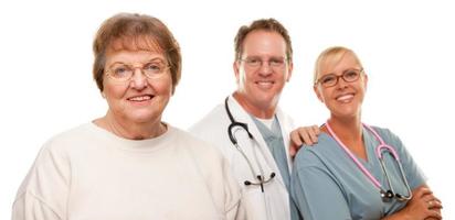 Smiling Senior Woman with Medical Doctor and Nurse Behind photo