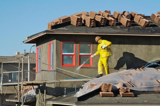 Construction Worker Pressure Washes photo