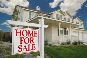 Home For Sale Sign in Front and New Home photo