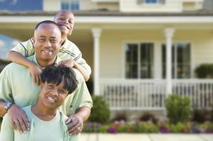 Attractive African American Family in Front of Home photo