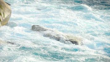 Turquoise waves rolled on the rocks, beach of Koh Miang island, Similan Islands, slow motion video