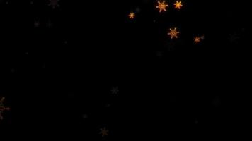 Beautiful falling down glow gold snowflakes animatinon black background video
