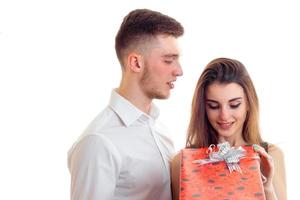 girl opens a gift from her boyfriend photo