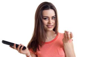 close-up portrait of a beautiful lady with remote control in hand photo