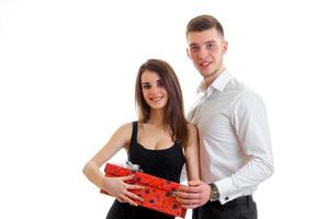 stylish young couple smiling with a big gift in the hands photo