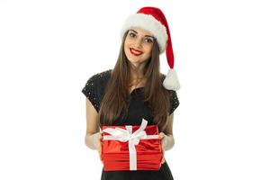 charming girl in santa hat with red photo