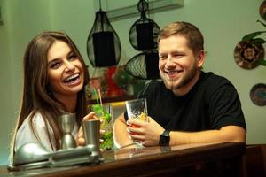 couple laughing at the bar photo