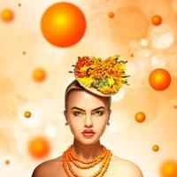 Beauty serious girl with rowan hairstyle orange background photo