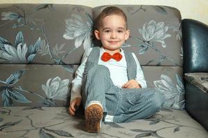 happy boy in elegant suit photo