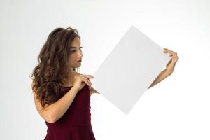 girl in red dress with white placard photo