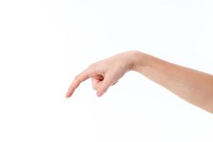 female hand with lowered down palms and forefinger isolated on white background photo