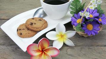 coffee in cup with chocolate chip cookies