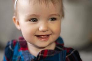 Cutie little baby girl smiles at home photo