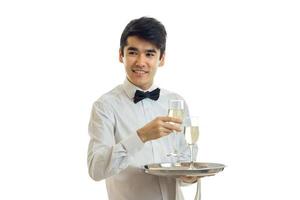 smiling awesome waiter shirt holding a glass of wine with a tray photo