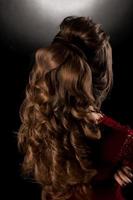 Charming young girl with beautiful curly hairstyle photo