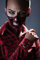 Female with scary make up for halloween night photo