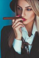 Gorgeous adult blonde woman smoking cigar photo