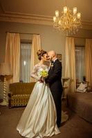 vertical portrait of beauty jusm married couple at home photo