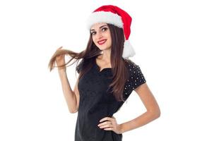 brunette girl in santa hat photo