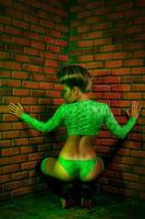 Backside photo of nice adult woman bear brick wall